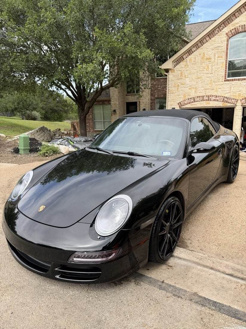 The same Porsche 911 after detailing, paint corrected to a mirror finish