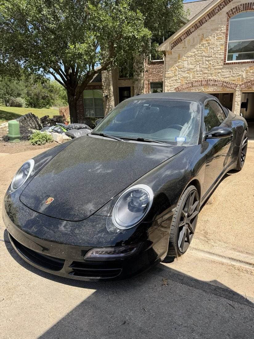 A Porsche 911 before detailing, paint dull and marked